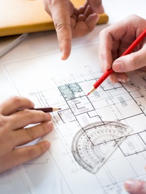 architects-discussing-table-with-blueprint-closeup-hands-project-print (1)